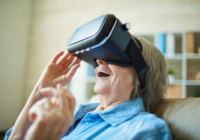 Astonished senior woman with vr glasses